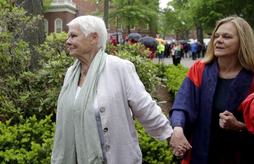 Actress Judi Dench, center, arrives at Harvard University with her niece, Harvard professor Emma Dench, right, before the start of Harvard commencement exercises, Thursday, May 25, 2017, in Cambridge, Mass. Judi Dench received an honorary Doctor of Arts degree during commencement exercises Thursday. (AP Photo/Steven Senne)