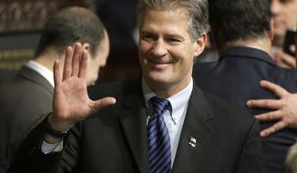 FILR - In this Jan. 8, 2015 file photo, former Massachusetts Sen. Scott Brown greets people on the floor of the House Chamber at the Statehouse in Boston. The Senate Foreign Relations Committee has approved the nomination of Brown to be U.S. ambassador to New Zealand. (AP Photo/Steven Senne, File)