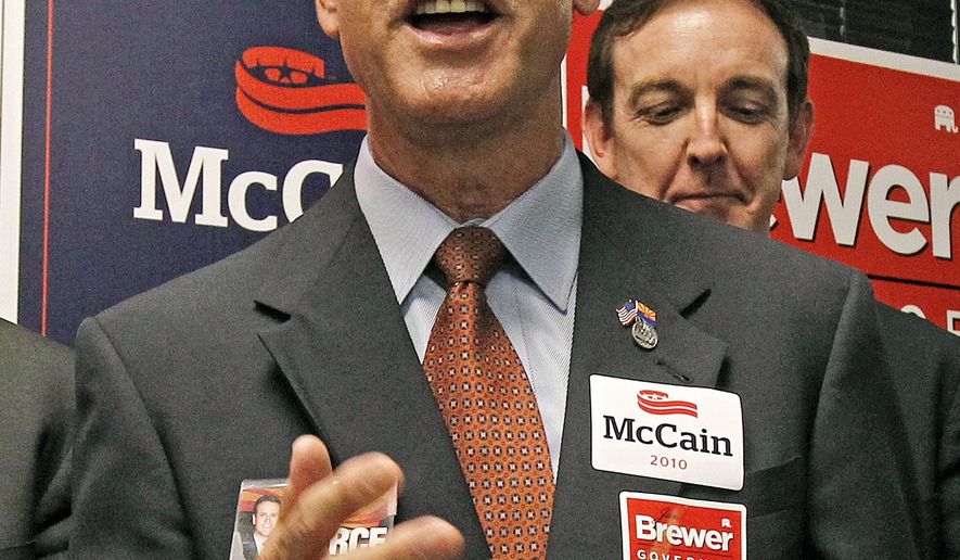 FILE- In this Aug. 26, 2010, file photo, Republican candidate for Corporation Commission Gary Pierce, campaigns with other Republican candidates in Phoenix. Pierce, the former Arizona utility regulator, was indicted Tuesday, May 23, 2017, on bribery and fraud charges in what prosecutors said was a scheme to funnel $31,000 in payments to him and arrange his purchase of a $350,000 property in exchange for favorable votes for a utility. (AP Photo/Ross D. Franklin, File)