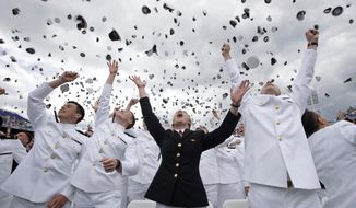 U.S. Naval Academy graduates celebrate at the end of the academy&#39;s graduation and commissioning ceremony in Annapolis, Md., Friday, May 26, 2017. (AP Photo/Patrick Semansky)