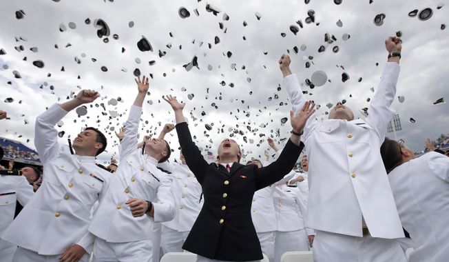 U.S. Naval Academy graduates celebrate at the end of the academy&#x27;s graduation and commissioning ceremony in Annapolis, Md., Friday, May 26, 2017. (AP Photo/Patrick Semansky)