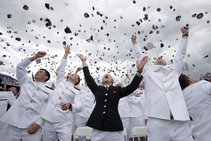 U.S. Naval Academy graduates celebrate at the end of the academy's graduation and commissioning ceremony in Annapolis, Md., Friday, May 26, 2017. (AP Photo/Patrick Semansky)