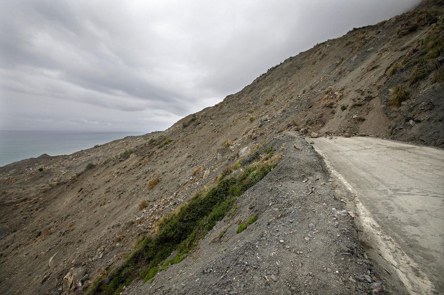 The Mud Creek slide covers Highway One in southern Monterey County on the coast of Big Sur, in Calif., Thursday, May 25, 2017. One of the wettest winters in decades in California has triggered slides and road closures along the central coast's Big Sur, forcing some resorts to close and others to use helicopters to carry in guests and supplies. (Vern Fisher/The Monterey County Herald via AP)