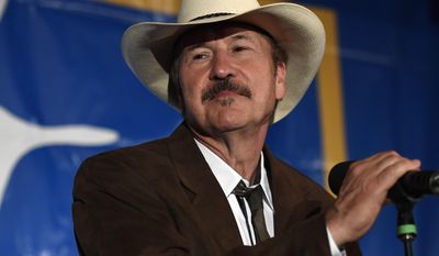 Democratic candidate Rob Quist holds the microphone as he begins his concession speech after losing to Republican candidate Greg Gianforte at the DoubleTree Hotel Thursday, May 25, 2017, in Missoula, Mont. Gianforte, a technology entrepreneur, defeated Quist to continue the GOP&#x27;s two-decade stronghold on the congressional seat. Democrats had hoped Quist, a musician and first-time candidate, could have capitalized on a wave of activism following President Donald Trump&#x27;s election. (Tommy Martino/The Missoulian via AP)