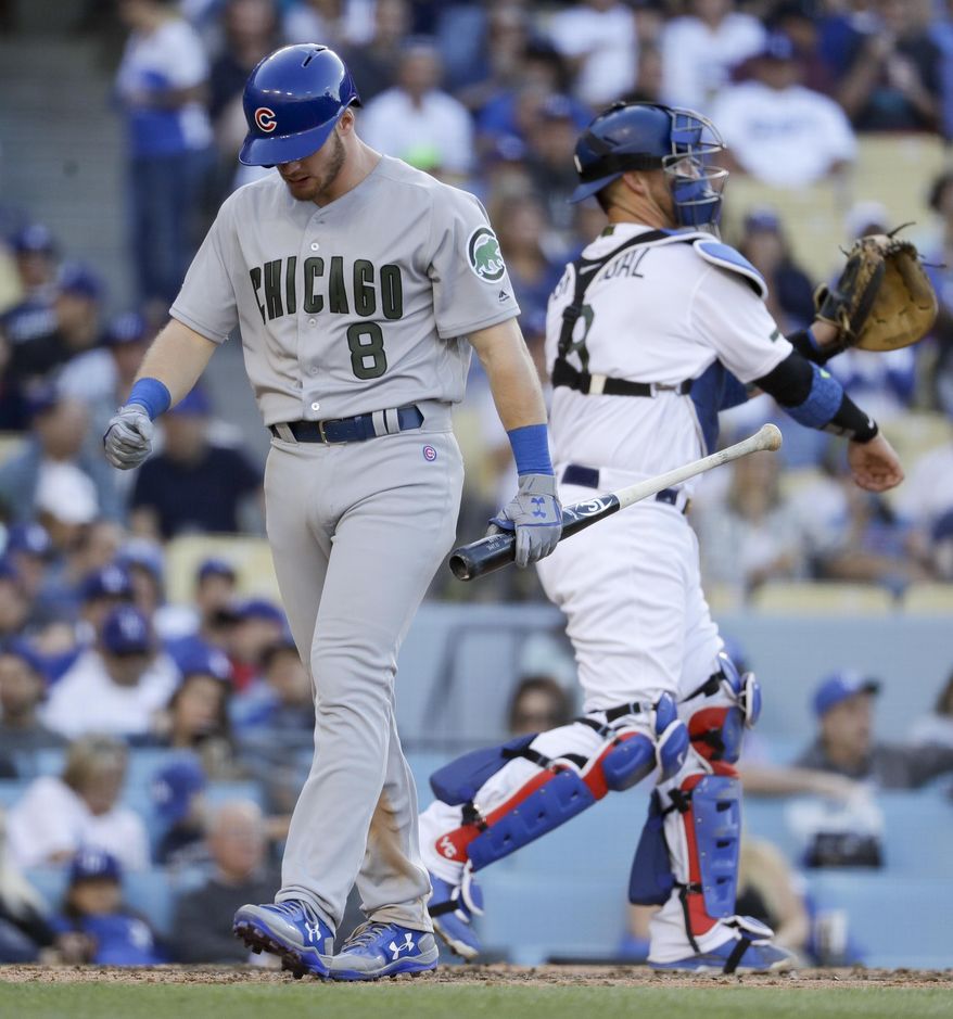 Chicago Cubs' Ian Happ walks off after striking out against the Los Angeles Dodgers during the seventh inning of a baseball game in Los Angeles, Saturday, May 27, 2017. (AP Photo/Chris Carlson)