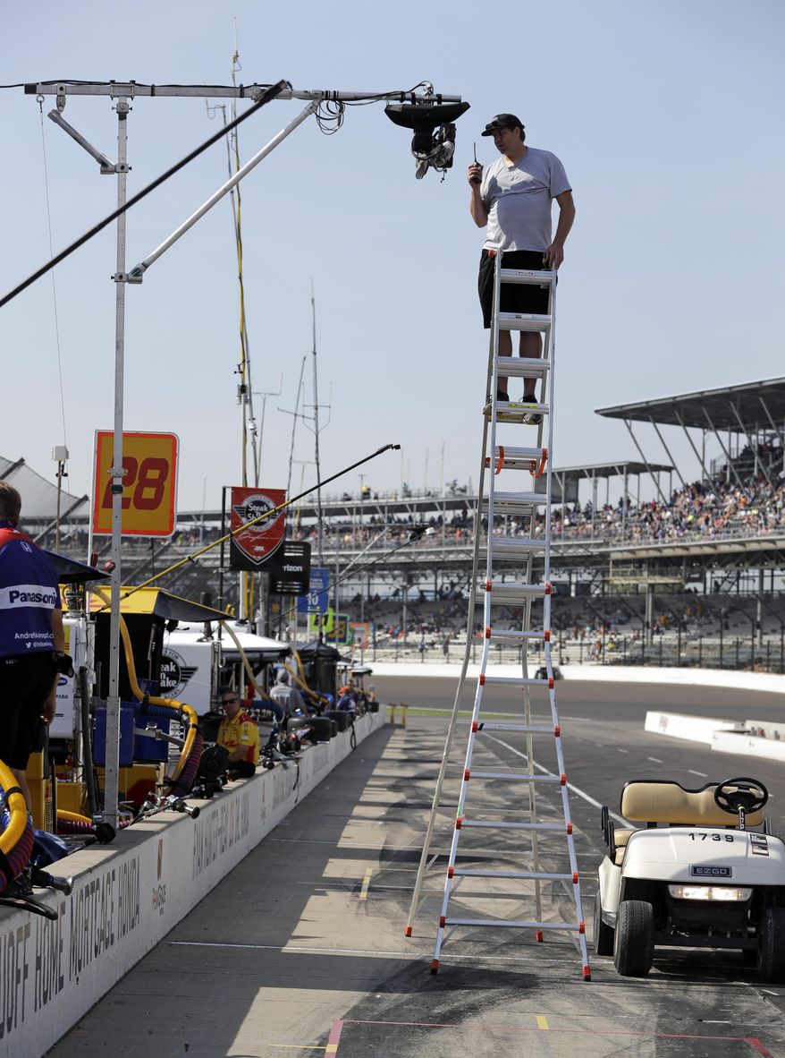 A technician checks on one the dozens of television cameras used for during the broadcast of the Indianapolis 500 IndyCar auto race at Indianapolis Motor Speedway, Friday, May 26, 2017 in Indianapolis. ABC and the Indy 500 have had a relationship lasting more than 50 years, back to the days of Wide World of Sports. It's become a proving ground for new technology and broadcast ideas. (AP Photo/Darron Cummings)