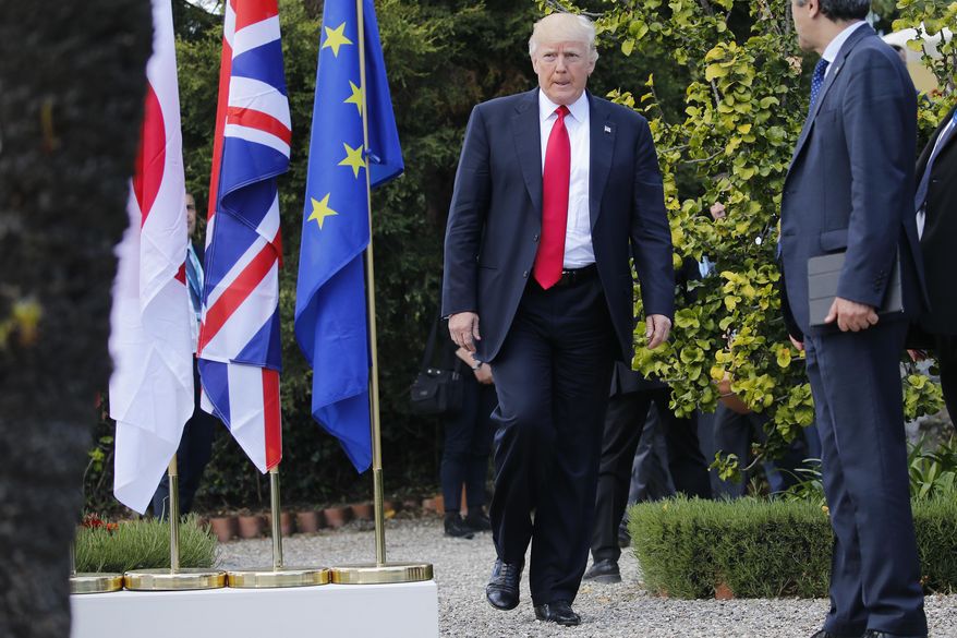 U.S. President Donald Trump arrives for a family photo of G7 leaders and Outreach partners at the Hotel San Domenico during a G7 summit in Taormina, Italy, Saturday, May 27, 2017. (Jonathan Ernst/Pool photo via AP)