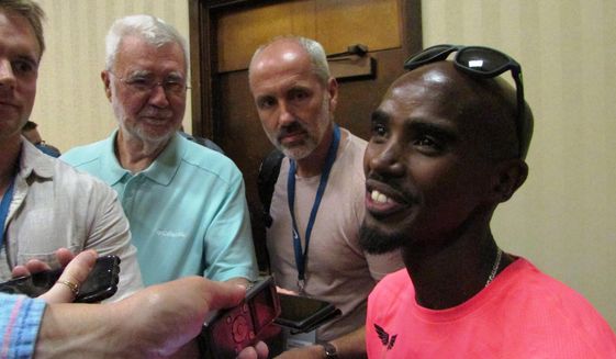 Olympic gold medalist Mo Farah speaks to reporters Friday, May 26, 2017, in advance of the Prefontaine Classic track meet in Eugene, Ore. Farah plans to run in the 5,000 meters. (AP Photo/Anne M. Peterson)