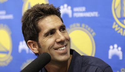 FILE - In this Sept. 22, 2016, file photo, Golden State Warriors general manager Bob Myers smiles during an NBA basketball media availability in Oakland, Calif. Myers has blended a thoughtful, hands-on, hands-off approach with the Golden State Warriors to make him one of the best general managers in sports. (AP Photo/Ben Margot, File)