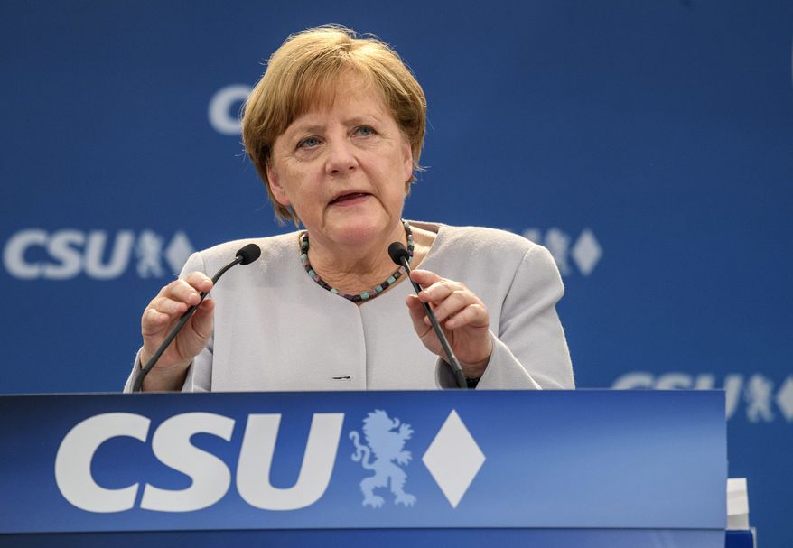 German Chancellor Angela Merkel delivers a speech during an election campaign of her Christian Democratic Union, CDU, and the Christian Social Union, CSU, in Munich, southern Germany, Sunday, May 28, 2017. Merkel is urging European Union nations to stick together in the face of new uncertainty over the United States and other challenges. (Matthias Balk/dpa via AP)