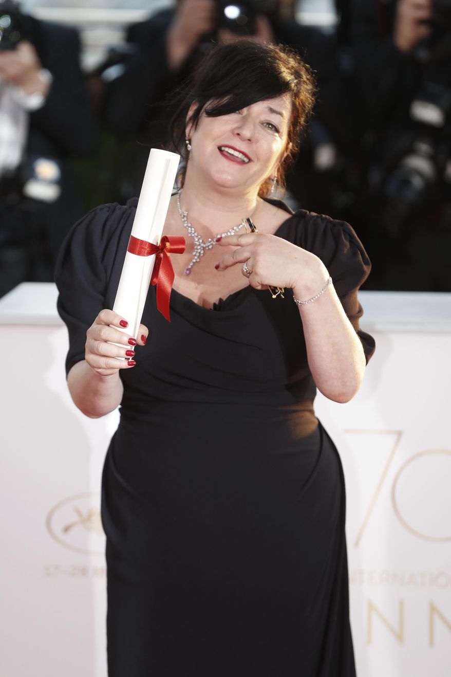 Directors Lynne Ramsay with her joint Best screenplay award for the film You Were Never Really Here poses for photographers during a photo call following the awards ceremony at the 70th international film festival, Cannes, southern France, Sunday, May 28, 2017. (AP Photo/Thibault Camus)