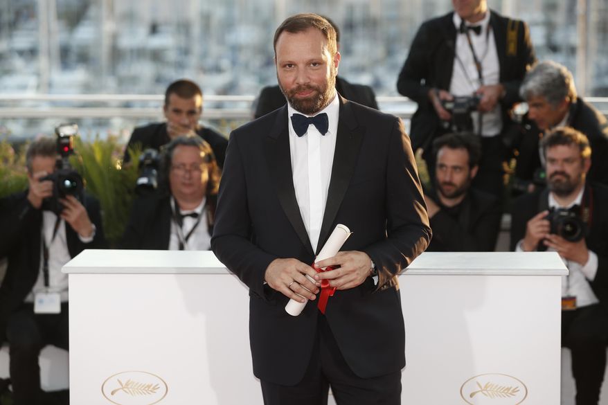 Directors Yorgos Lanthimos with his joint Best screenplay award for the film A Killing of a Sacred Deer poses for photographers during a photo call following the awards ceremony at the 70th international film festival, Cannes, southern France, Sunday, May 28, 2017. (AP Photo/Thibault Camus)