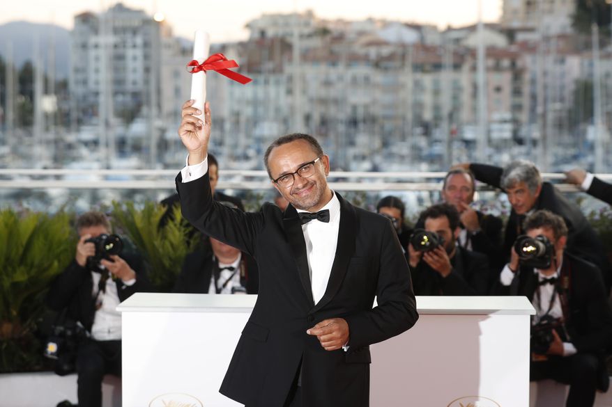 Director Andrey Zvyagintsev with his Jury Prize award for his film Loveless poses for photographers during a photo call following the awards ceremony at the 70th international film festival, Cannes, southern France, Sunday, May 28, 2017. (AP Photo/Thibault Camus)