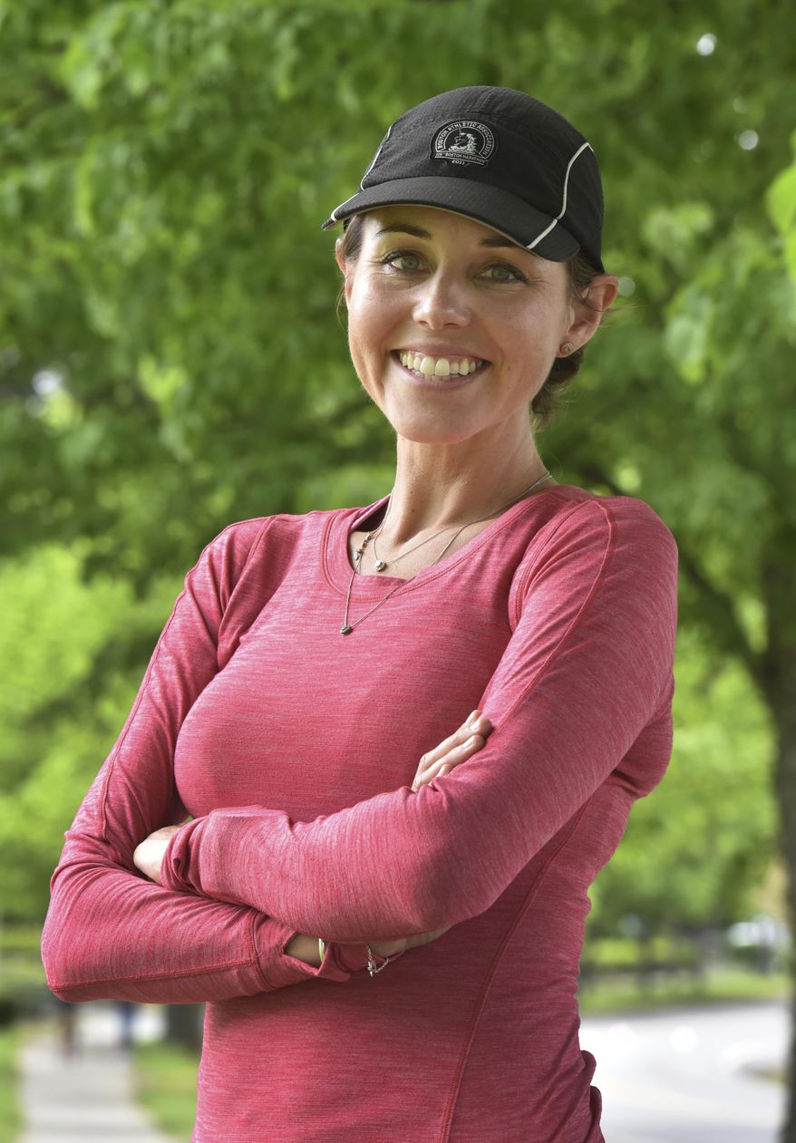 In this May 18, 2017 photo, Alexis Erickson stands along one of her favorite running routes in Olympia, Wash. Erickson will be a group pacing runner during the Capital City Marathon. For the Capital High School graduate this is her first marathon after being diagnosed with breast cancer last August, and has continued to run throughout chemotherapy, and finishing treatment in January. (Steve Bloom /The Olympian via AP)