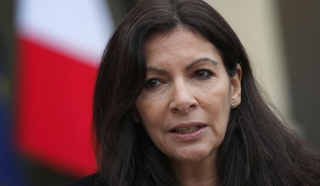 FILE - This Thursday, March 9, 2017 file photo shows Paris mayor, Anne Hidalgo, speaking to media after a meeting with French president Francois Hollande, at the Elysee Palace, in Paris, France. Paris&#x27; mayor Anne Hidalgo has strongly criticized a black feminist festival in Paris that bans non-black people in large parts of the event, saying she might prosecute its organizers on grounds of discrimination. (AP Photo/Christophe Ena, File)