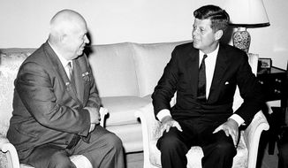 In this June 3, 1961, photo, Soviet Premier Nikita Khrushchev and President John F. Kennedy talk in the residence of the U.S. Ambassador in a suburb of Vienna. The meeting was part of a series of talks during their summit meetings in Vienna. Monday, May 29, 2017 marks the 100-year anniversary of Kennedy&#39;s birth. (AP Photo/File)