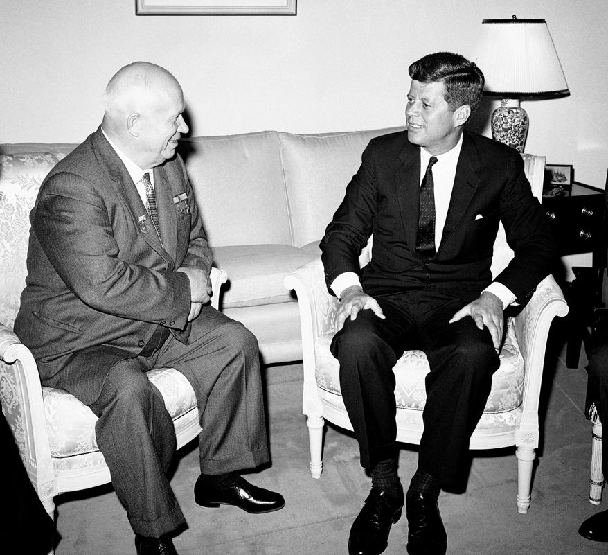 In this June 3, 1961, photo, Soviet Premier Nikita Khrushchev and President John F. Kennedy talk in the residence of the U.S. Ambassador in a suburb of Vienna. The meeting was part of a series of talks during their summit meetings in Vienna. Monday, May 29, 2017 marks the 100-year anniversary of Kennedy&#x27;s birth. (AP Photo/File)