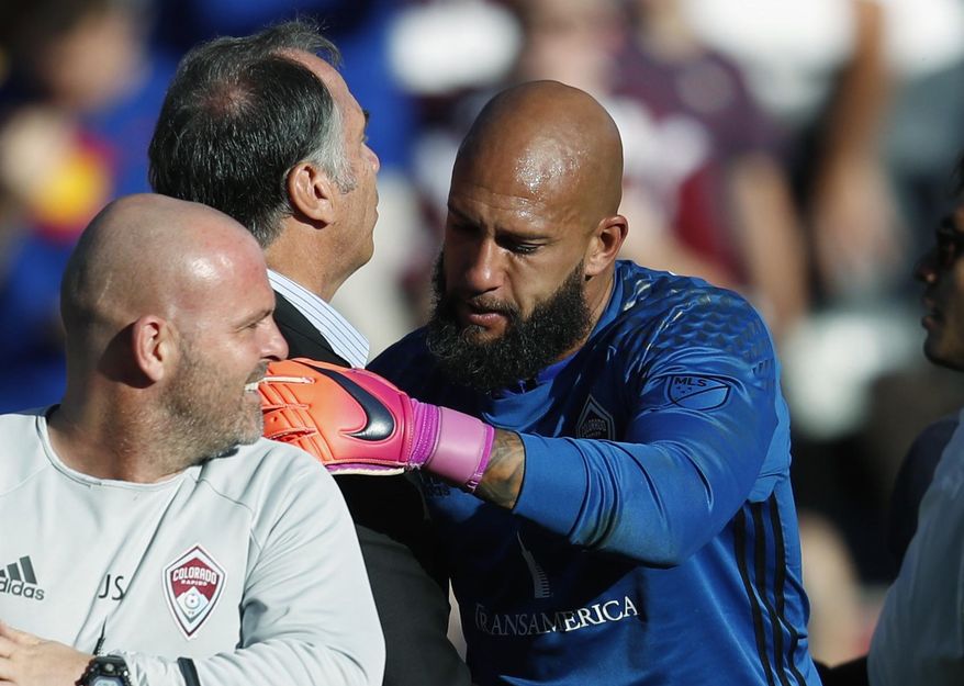 FILE--In this Nov. 6, 2016, file photo, Los Angeles Galaxy head coach Bruce Arena, left, congratulates Colorado Rapids goalkeeper Tim Howard after Howard stopped shots in the second-leg soccer match of the Western Conference semifinals of the MLS cup playoffs in Commerce City, Colo. Arena discussed his roster on Monday, May 29, 2017, as players gather to train for a World Cup qualifying match against Trinidad and Tobago on June 8 in Commerce City. (AP Photo/David Zalubowski, File)