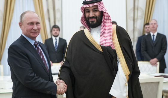 Russian President Vladimir Putin, left, shakes hands with Saudi Deputy Crown Prince and Defense Minister Mohammed bin Salman in Moscow&#39;s Kremlin, Russia, Tuesday, May 30, 2017. (AP Photo/Pavel Golovkin, pool)