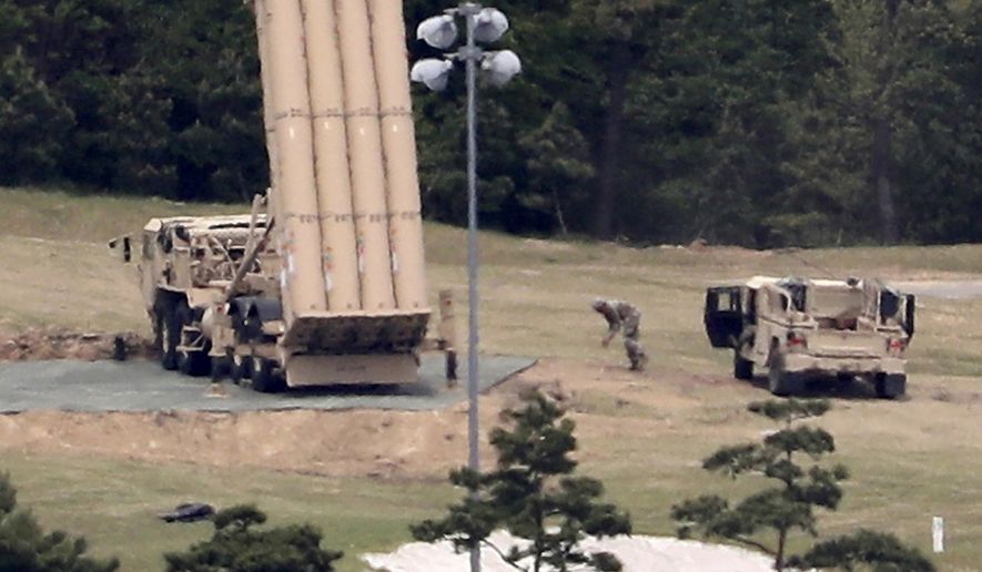 FILE - In this May 2, 2017, file photo, a U.S. missile defense system called Terminal High Altitude Area Defense, or THAAD, is installed on a golf course in Seongju, South Korea. (Kim Jun-beom/Yonhap via AP, File)