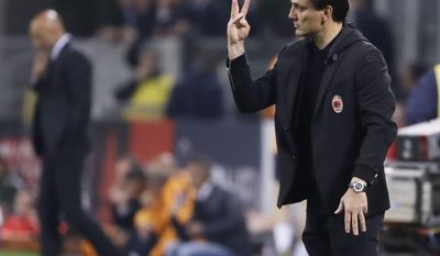 FILE - In this Sunday, May 7, 2017 file photo, AC Milan coach Vincenzo Montella gives indications during a Serie A soccer match between AC Milan and Roma, at the San Siro stadium in Milan, Italy, Sunday, May 7, 2017.  Vncenzo Montella has extended his contract as AC Milan manager by one year through the 2018-19 season. The announcement was made live on Facebook with Montella, Milan CEO Marco Fassone and sporting director Massimiliano Mirabelli. The move comes two days after Montella guided Milan to a sixth-place finish in Serie A and a spot in the Europa League playoffs in his first season in charge. (AP Photo/Luca Bruno, File)