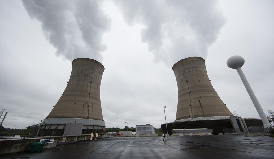 A Monday, May 22, 2017 file photo shows cooling towers at the Three Mile Island nuclear power plant in Middletown, Pa. Exelon Corp., the owner of Three Mile Island, site of the United States' worst commercial nuclear power accident, said Monday, May 29, 2017 it will shut down the plant in 2019 without a financial rescue from Pennsylvania. (AP Photo/Matt Rourke, File)