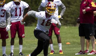 In this May 14, 2016, file photo, Washington Redskins wide receiver Josh Doctson, 18, works out during NFL football rookie minicamp in Ashburn, Va. (AP Photo/Jose Luis Magana, File) **FILE**