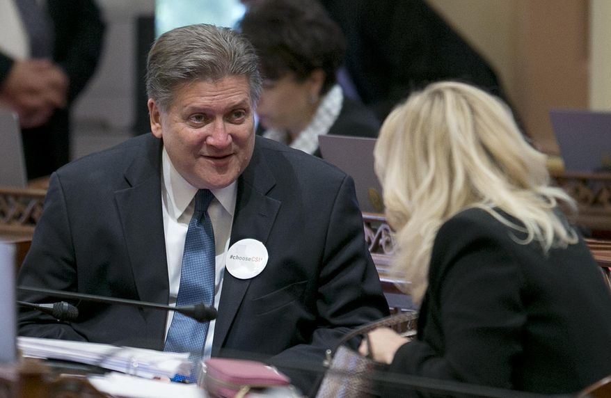 State Sen. Bob Hertzberg, D-Van Nuys, talks with Sen. Cathleen Galgiani, D-Stockton, right, after lawmakers approved his measure to change the state's bail and pretrial release policies, Wednesday, May 31, 2017, in Sacramento, Calif. By a 25-11 vote, the Senate approved Hertzberg's bill, SB10, that would end money bail for most defendants. It now goes to the Assembly. (AP Photo/Rich Pedroncelli)