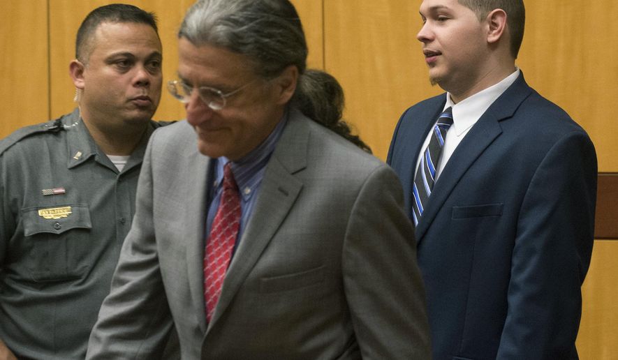 Tony Moreno, right, enters the courtroom in Middlesex Superior Court on Wednesday, May 31, 2017, for sentencing. Moreno was found guilty of murder and risk of injury to a child in February. He threw his 7-month-old son Aaden to his death from the Arrigoni Bridge on July 5, 2015. He then jumped off, but survived. (Patrick Raycraft/Hartford Courant via AP, Pool)