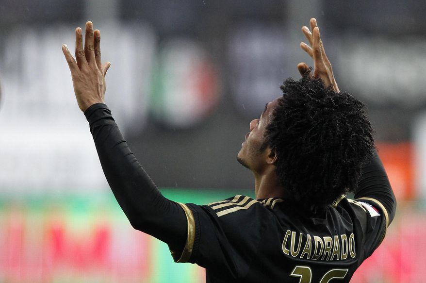 FILE - In this Sunday, Feb. 7, 2016 file photo Juventus' Juan Cuadrado celebrates after scoring during a Serie A soccer match between Frosinone and Juventus, at Frosinone's Comunale stadium, Italy. If there's one player who has benefitted most from coach Massimiliano Allegri's daring five-forward formation at Juventus, it's winger Juan Cuadrado. (AP Photo/Riccardo De Luca, file)