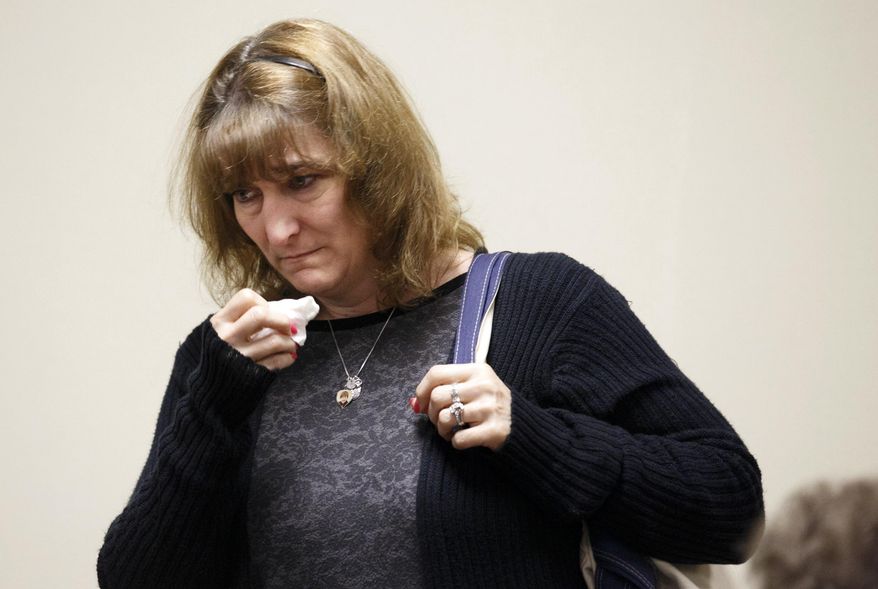 Lisa Creato, mother of defendant David "D.J." Creato Jr.,uses a tissue after Judge John Kelley announced that the jury was unable reach a verdict after five days of deliberations in her son's murder trial Wednesday, May 31, 2017, at the Camden County Courthouse in Camden, N.J. Judge Kelley declared a mistrial one day after the jury first told him they couldn't agree on a verdict against Creato accused of killing his 3-year-old son. ( Jessica Griffin/The Philadelphia Inquirer via AP, Pool)