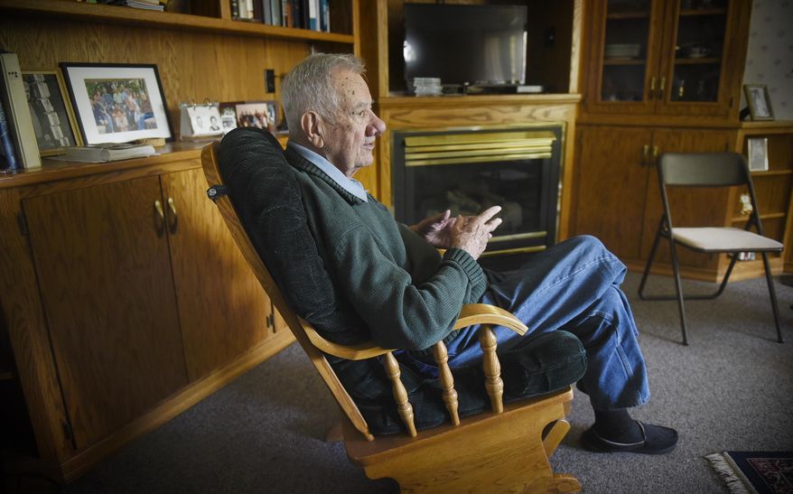 ADVANCE FOR WEEKEND EDITIONS, JUNE 3-4 - In this May 16, 2017 photo, Keith Maurer shares memories of his years at Technical High School during an interview at his home in St. Cloud, Minn. Maurer graduated from Tech in 1942 and served in the U.S. Navy during World War II. (Dave Schwarz/St. Cloud Times via AP)