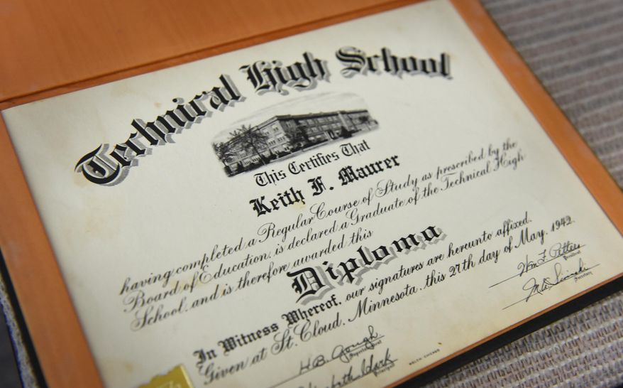 ADVANCE FOR WEEKEND EDITIONS, JUNE 3-4 - In this May 16, 2017 photo, Keith Maurer 1942 graduation certificate from Technical High School is displayed at his home in St. Cloud, Minn. Maurer graduated from Tech in 1942 and served in the U.S. Navy during World War II. (Dave Schwarz/St. Cloud Times via AP)