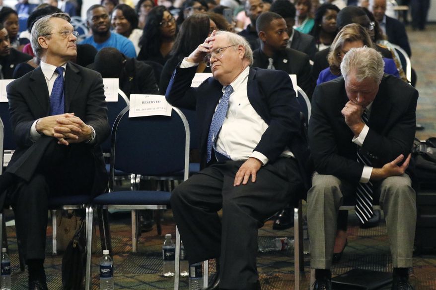 College Board members Doug Rouse, left, Alan Perry, center, and Institutions of Higher Learning Commissioner Glenn Boyce, listen to comments by students regarding the selection process by which the board made current Mississippi Valley State President William Bynum, their preferred choice to become the next president of the Jackson State University during a visit to the Jackson, Miss., based liberal arts university, Wednesday, May 31, 2017. (AP Photo/Rogelio V. Solis)