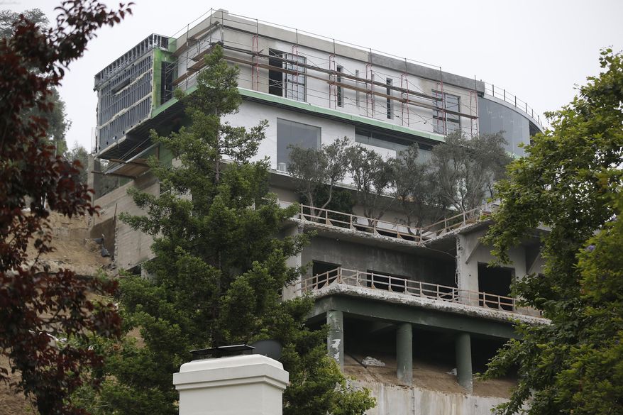 A 30,000-square-foot structure is seen unfinished in Los Angeles Wednesday, May. 31, 2017. Mohamed Hadid, a developer of luxury homes has pleaded no contest in Los Angeles to misdemeanor charges stemming from construction of this Bel Air mansion that the city says has extensive features that were never approved. City officials ordered work on the gigantic home stopped three years ago amid claims by neighbors below that the hillside above their homes had been destabilized. (AP Photo/Damian Dovarganes)