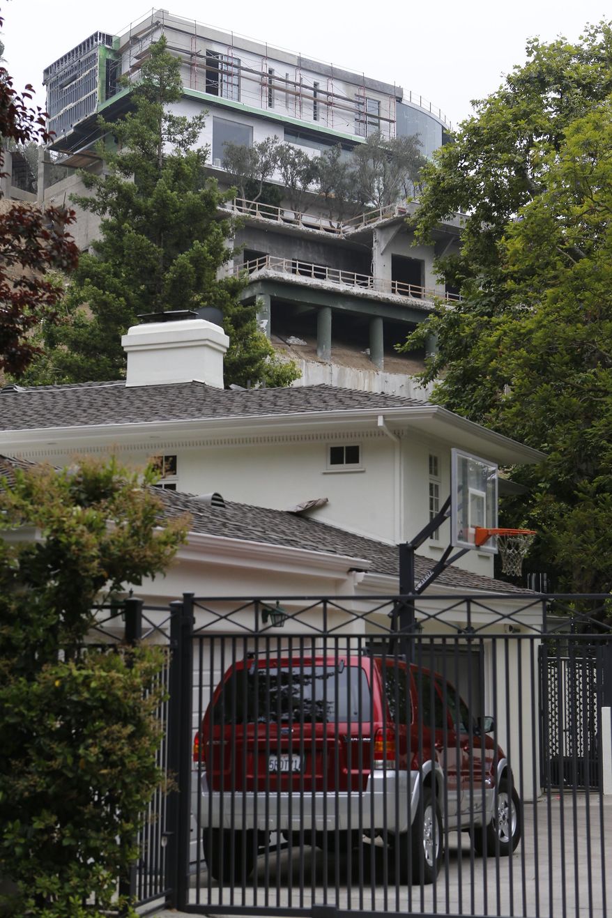 A 30,000-square-foot structure is seen unfinished in Los Angeles Wednesday, May. 31, 2017. Mohamed Hadid, a developer of luxury homes has pleaded no contest in Los Angeles to misdemeanor charges stemming from construction of this Bel Air mansion that the city says has extensive features that were never approved. City officials ordered work on the gigantic home stopped three years ago amid claims by neighbors below that the hillside above their homes had been destabilized. (AP Photo/Damian Dovarganes)