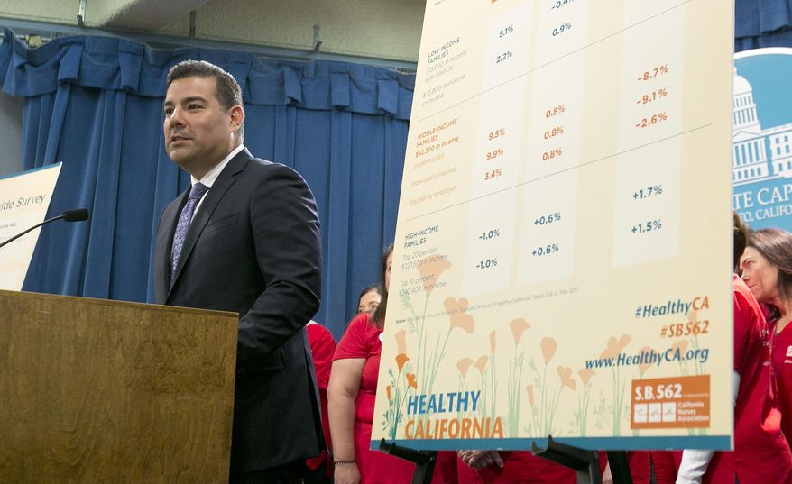 State Sen. Ricardo Lara, D-Bell Gardens, discusses his single-payer health care bill at a Capitol news conference, Wednesday, May 31, 2017, in Sacramento, Calif. (AP Photo/Rich Pedroncelli)