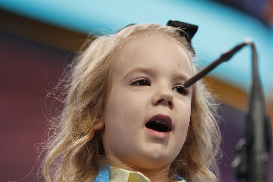 Edith Fuller, 6, from Tulsa, Okla., spells her word during the 90th Scripps National Spelling Bee, Wednesday, May 31, 2017, in Oxon Hill, Md. (AP Photo/Alex Brandon)