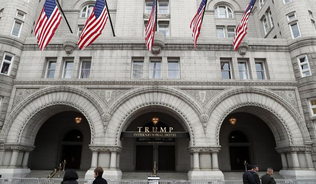 In this photo taken Dec. 21, 2016, the Trump International Hotel in Washington. A Pennsylvania man has been arrested at the Trump International Hotel in Washington after police say they found a rifle and handgun in his car. (AP Photo/Alex Brandon) ** FILE **