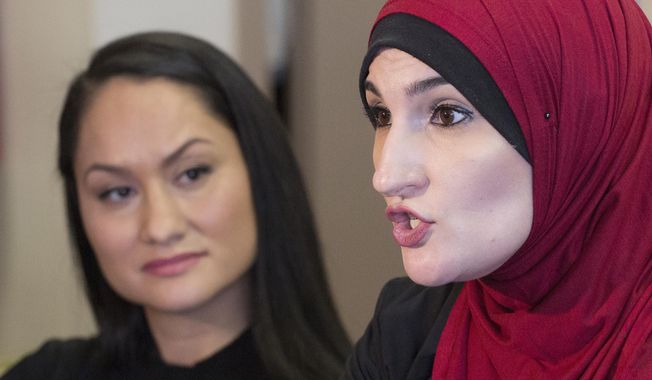 In this Jan. 9, 2017, file photo Linda Sarsour, right, and Carmen Perez, co-chairs of the Women&#x27;s March on Washington, speak during an interview in New York. Sarsour was scheduled to speak at a college commencement ceremony in New York City on Thursday, June 1, 2017, despite protests from critics who don&#x27;t like her views on Israel. (AP Photo/Mark Lennihan, File)