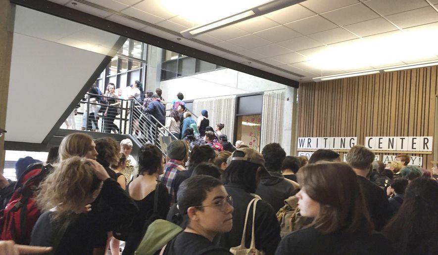 In this Wednesday, May 24, 2017, photo, after weeks of brewing racial tension on campus, hundreds of students at the Evergreen State College in Olympia, Wash., protest against the college administration and demanded change. (Lisa Pemberton/The Olympian via AP) ** FILE **