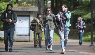 Students leave The Evergreen State College campus in Olympia after a threat prompted a student alert and evacuation on Thursday, June 1, 2017.  The announcement posted on the school&#39;s website Thursday asked everyone to leave the Olympia campus or return to residence halls for further instructions. The post did not provide other details. (Tony Overman /The Olympian via AP)