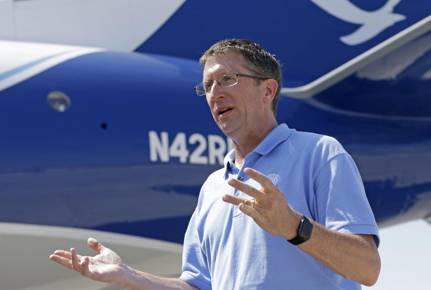 In this photo taken Friday, May 12, 2017, National Hurricane Center Director Dr. Rick Knabb talks to a reporter, at the U.S. Coast Guard Air Station Miami, at the Miami-Opa Locka Executive Airport, in Opa-locka, Fla. On his last day as hurricane center director before returning to The Weather Channel, Knabb said better data and better computer models help create in narrower cone. A narrower cone gets more and more useless for telling you where the impacts of wind and water are going to be. (AP Photo/Alan Diaz)