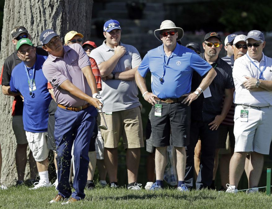 Jason Dufner chips to the 15th green during the first round of the Memorial golf tournament, Thursday, June 1, 2017, in Dublin, Ohio. (AP Photo/Darron Cummings)