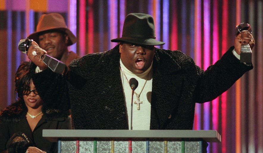 FILE - This Dec. 6, 1995, file photo shows Notorious B.I.G accepting rap artist and rap single of the year during the Billboard Music Awards in New York. The late rap icon, born Christopher Wallace, will be honored at the ASCAP Rhythm & Soul Awards on June 22, 2017. (AP Photo/Mark Lennihan, File)