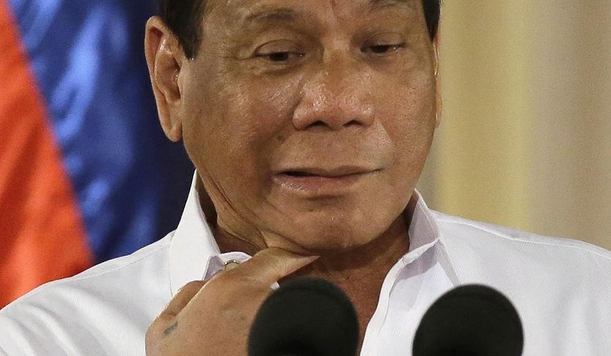 Philippine President Rodrigo Duterte gestures during his speech at the swearing in of municiple at the Malacanang presidential palace in Manila, Philippines on Thursday, June 1, 2017. (AP Photo/Aaron Favila) ** FILE **