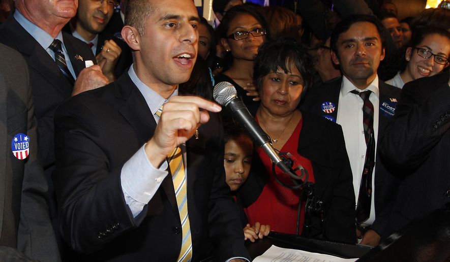 FILE - In this Dec. 4, 2014 file photo, Democrat Jorge Elorza celebrates his win over Independent Vincent Cianci, Jr. in the Providence mayoral race, in Providence, R.I. Rhode Island's largest city, Providence, has approved Thursday, June 1, 2017, final passage of a police accountability measure proponents say could be a national model to prevent discriminatory profiling based on race, gender identity and immigration status. Elorza has said he'll sign the legislation into law. (AP Photo/Stew Milne, File)