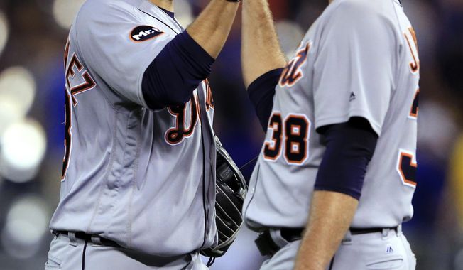 Detroit Tigers right fielder J.D. Martinez, left, and relief pitcher Justin Wilson celebrate following the team&#x27;s baseball game against the Kansas City Royals at Kauffman Stadium in Kansas City, Mo., Wednesday, May 31, 2017. The Tigers defeated the Royals 6-5. (AP Photo/Orlin Wagner)