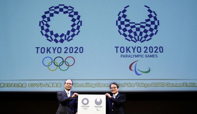 FILE - In this April 25, 2016, file photo, Tokyo 2020 Emblems Selection Committee Chairperson Ryohei Miyata, right, and its member and Japanese baseball great Sadaharu Oh hold new official logos of the 2020 Tokyo Olympics, left, and the 2020 Tokyo Paralympic Games during the unveiling ceremony in Tokyo. The cost of the 2020 Tokyo Olympics is nearly twice the initial estimate despite a major cost-cutting effort. A major reason is that cities exclude large amounts of associated costs when they bid to host the Olympics. Tokyo Olympic organizers announced this week that the estimated cost is now 1.4 trillion yen ($12.6 billion). The bid estimate was 730 billion yen ($6.6 billion). (AP Photo/Shizuo Kambayashi, File)
