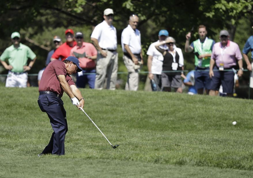 Phil Mickelson hits on the seventh hole during the second round of the Memorial golf tournament, Friday, June 2, 2017, in Dublin, Ohio. (AP Photo/Darron Cummings)